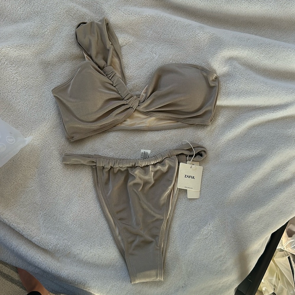 Sadly tan bathing suit.